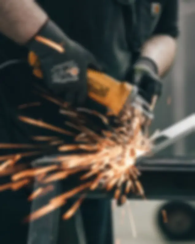 Construction professional working with a welding machine